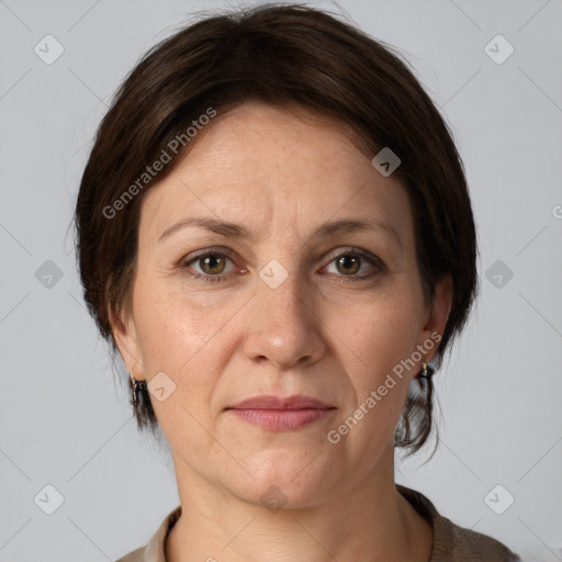 Joyful white adult female with medium  brown hair and grey eyes