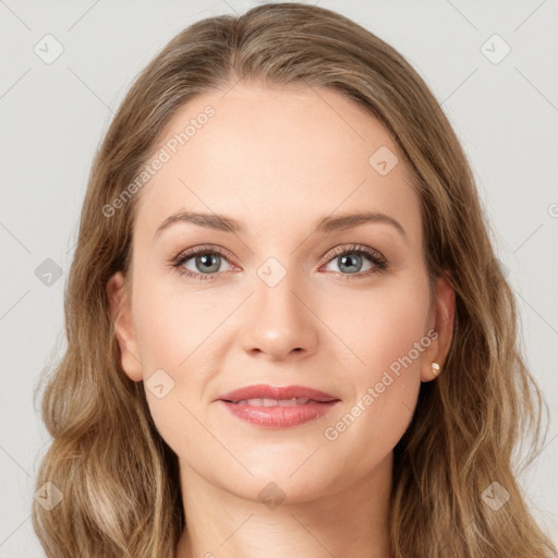 Joyful white young-adult female with long  brown hair and green eyes