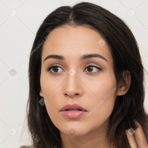 Neutral latino young-adult female with long  brown hair and brown eyes