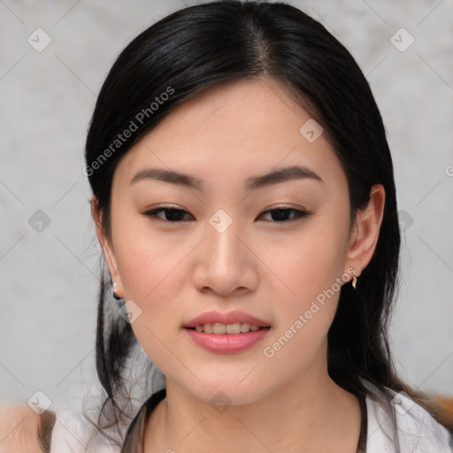 Joyful asian young-adult female with medium  black hair and brown eyes