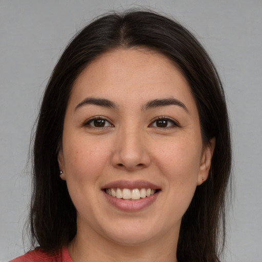 Joyful white young-adult female with medium  brown hair and brown eyes