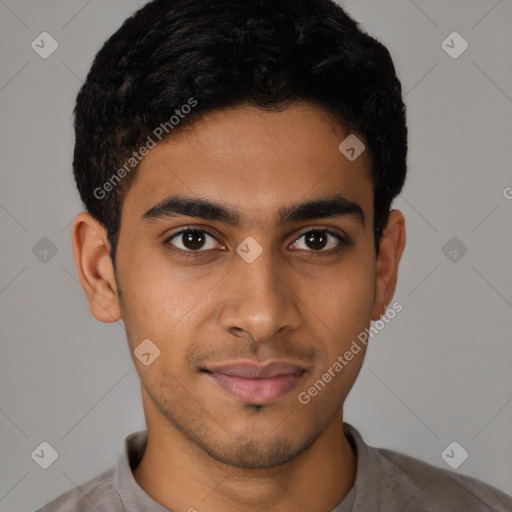 Joyful latino young-adult male with short  brown hair and brown eyes