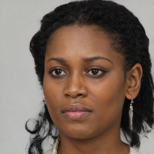 Neutral black young-adult female with long  black hair and brown eyes