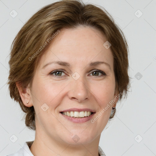 Joyful white adult female with medium  brown hair and grey eyes