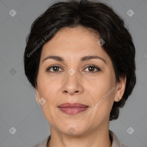 Joyful white adult female with medium  brown hair and brown eyes