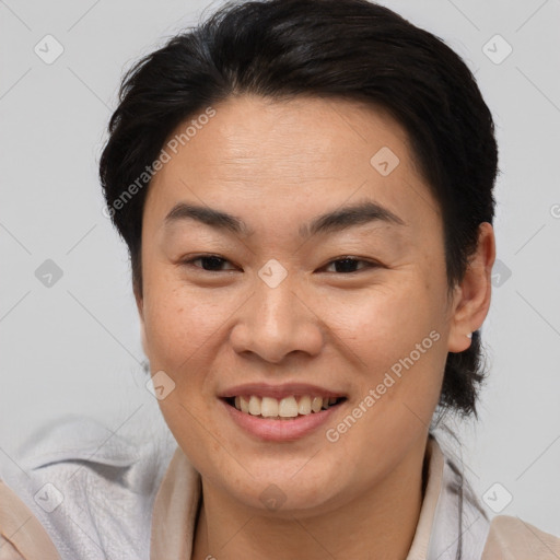 Joyful asian young-adult female with medium  brown hair and brown eyes