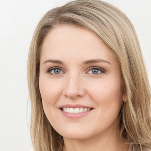 Joyful white young-adult female with long  brown hair and green eyes