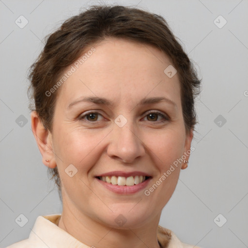 Joyful white adult female with short  brown hair and brown eyes