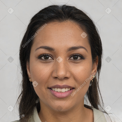 Joyful latino young-adult female with medium  brown hair and brown eyes