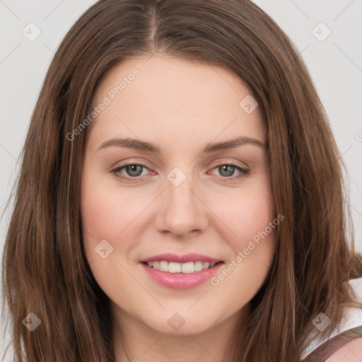 Joyful white young-adult female with long  brown hair and green eyes