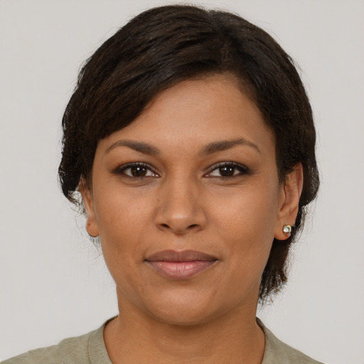 Joyful asian young-adult female with short  brown hair and brown eyes