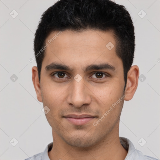 Joyful white young-adult male with short  black hair and brown eyes