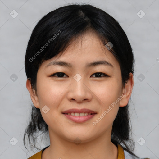 Joyful asian young-adult female with medium  black hair and brown eyes