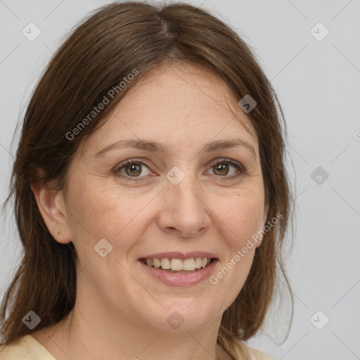 Joyful white adult female with medium  brown hair and grey eyes