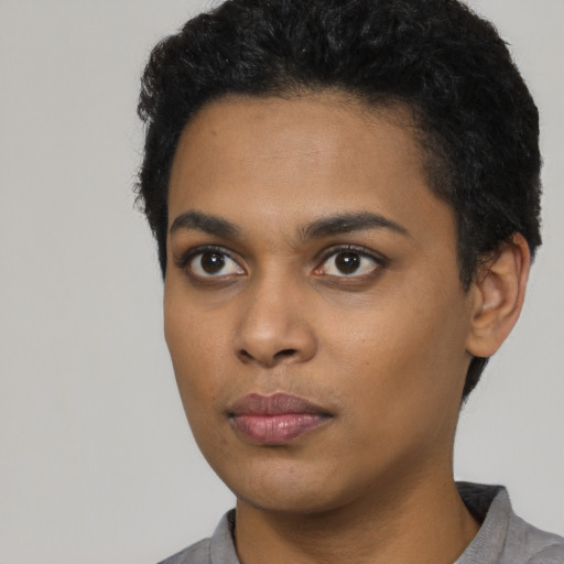 Neutral latino young-adult female with short  black hair and brown eyes