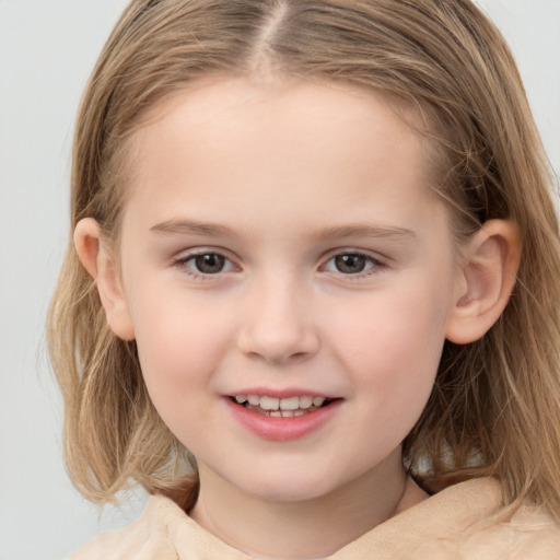 Joyful white child female with medium  brown hair and grey eyes