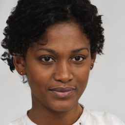 Neutral black young-adult female with short  brown hair and brown eyes