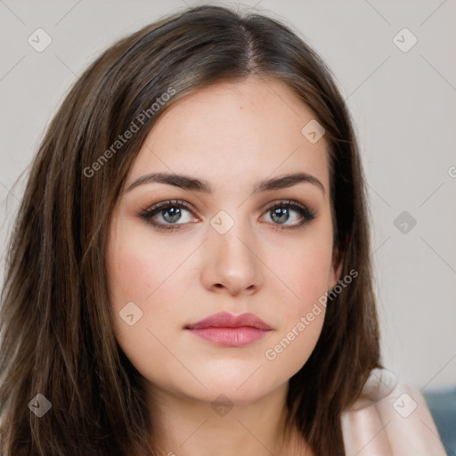 Neutral white young-adult female with long  brown hair and brown eyes