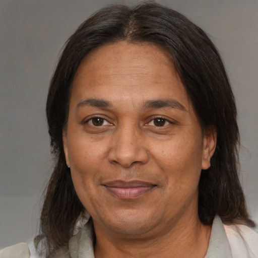 Joyful white adult female with medium  brown hair and brown eyes