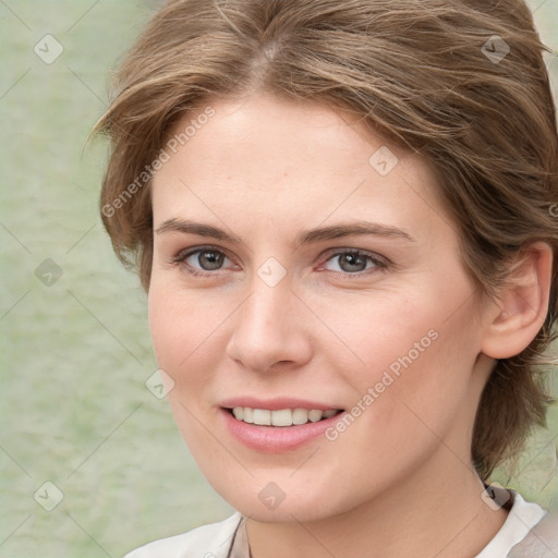 Joyful white young-adult female with medium  brown hair and blue eyes