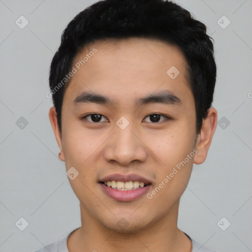 Joyful asian young-adult male with short  black hair and brown eyes