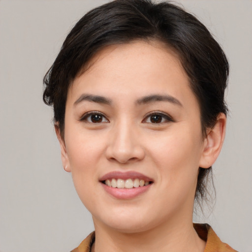 Joyful white young-adult female with medium  brown hair and brown eyes