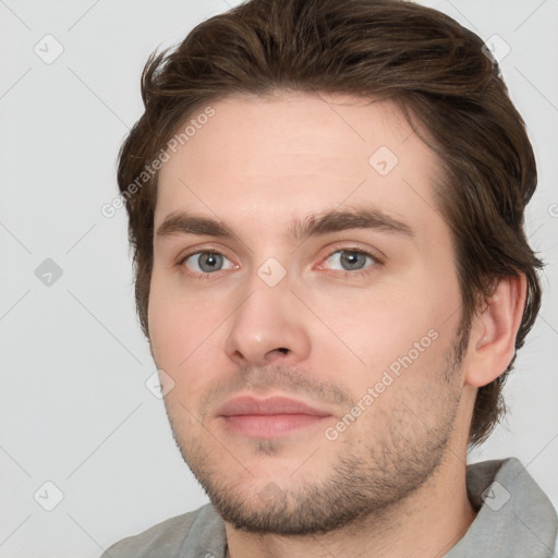 Neutral white young-adult male with short  brown hair and grey eyes