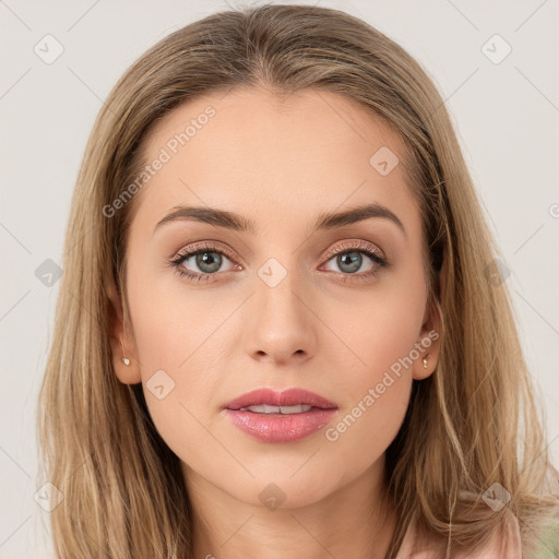 Joyful white young-adult female with long  brown hair and blue eyes