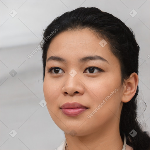 Joyful asian young-adult female with medium  black hair and brown eyes