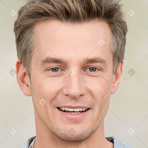 Joyful white adult male with short  brown hair and grey eyes