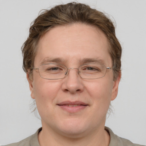 Joyful white adult male with short  brown hair and grey eyes