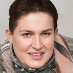 Joyful white adult female with medium  brown hair and blue eyes