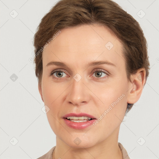 Joyful white young-adult female with short  brown hair and grey eyes