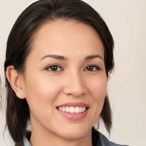 Joyful white young-adult female with medium  brown hair and brown eyes