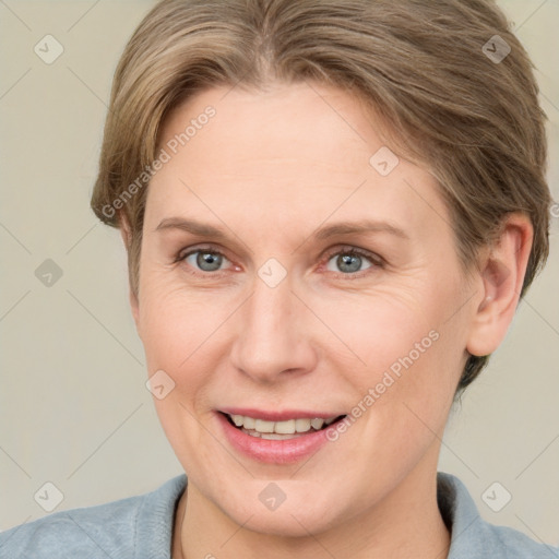 Joyful white adult female with short  brown hair and grey eyes