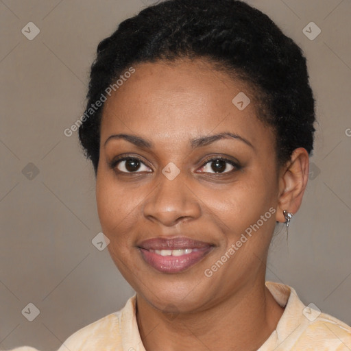 Joyful black young-adult female with short  brown hair and brown eyes