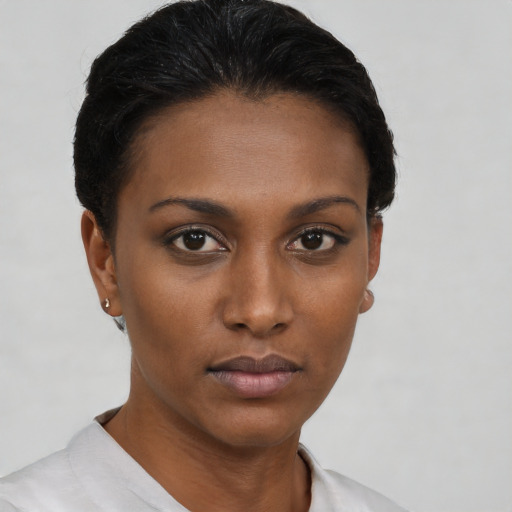Neutral black young-adult female with short  black hair and brown eyes