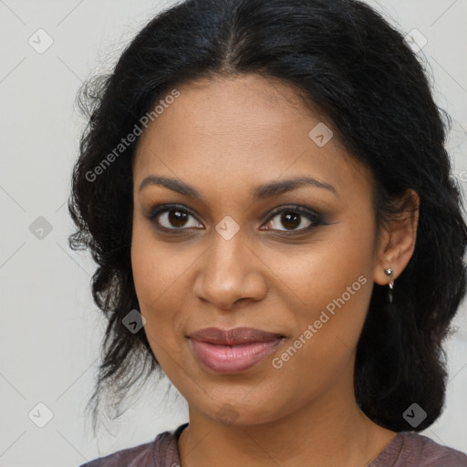 Joyful black young-adult female with long  brown hair and brown eyes