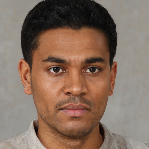 Neutral latino young-adult male with short  black hair and brown eyes