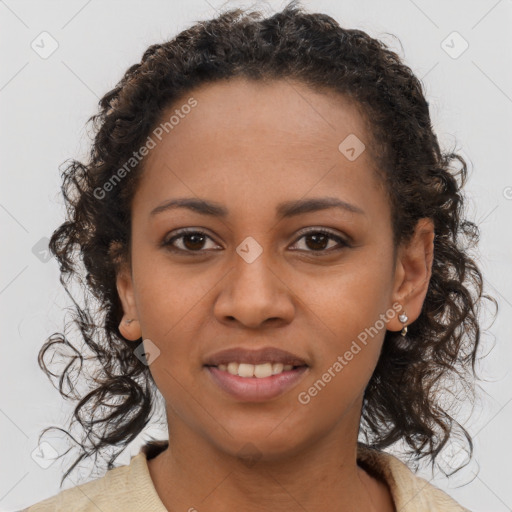 Joyful black young-adult female with long  brown hair and brown eyes