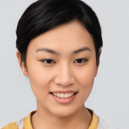 Joyful asian young-adult female with short  brown hair and brown eyes