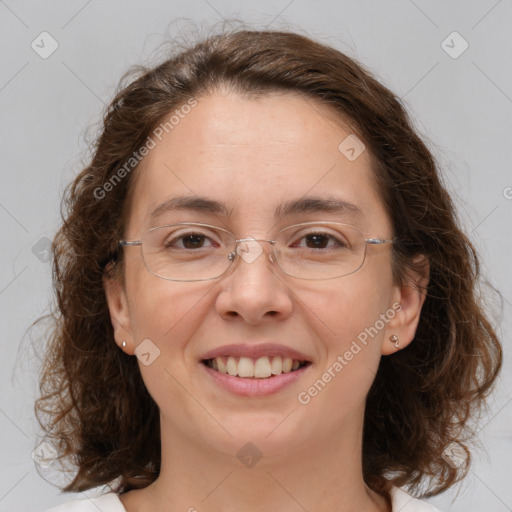 Joyful white adult female with medium  brown hair and green eyes