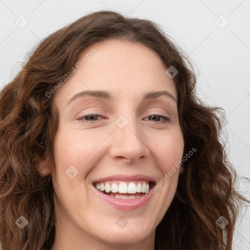 Joyful white young-adult female with long  brown hair and green eyes