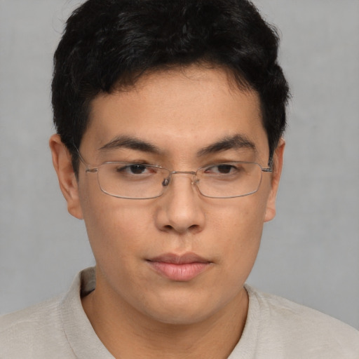 Neutral asian young-adult male with short  brown hair and brown eyes