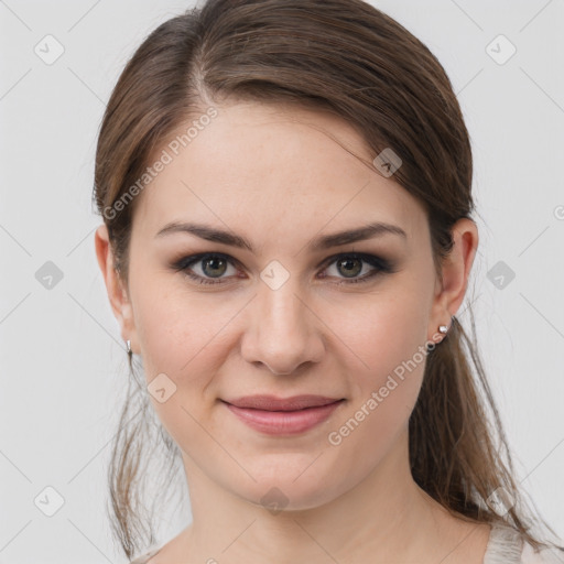 Joyful white young-adult female with medium  brown hair and grey eyes