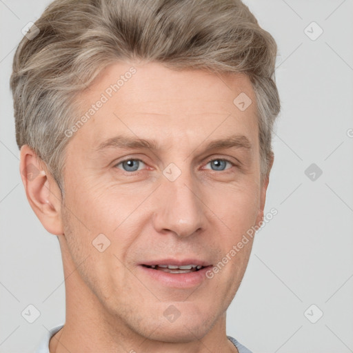 Joyful white adult male with short  brown hair and grey eyes