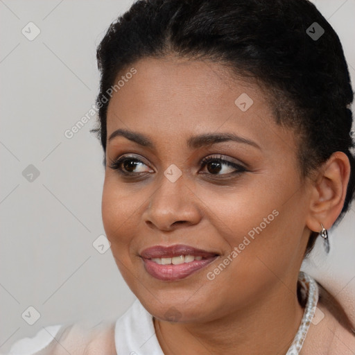 Joyful black young-adult female with short  brown hair and brown eyes