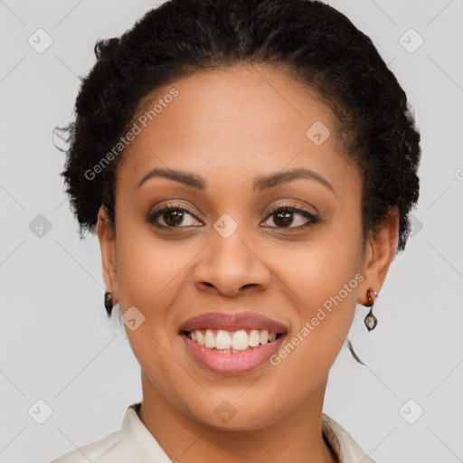 Joyful black young-adult female with short  brown hair and brown eyes