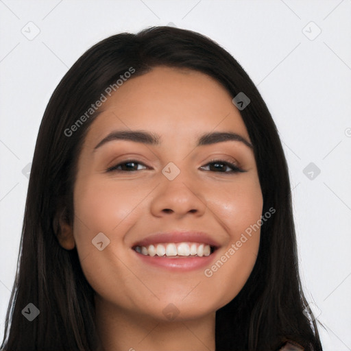 Joyful latino young-adult female with long  black hair and brown eyes