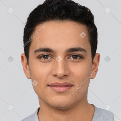 Joyful white young-adult male with short  black hair and brown eyes